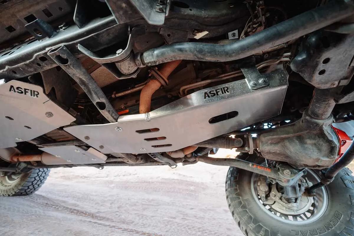 ASFIR aluminum skid plates under a Nissan truck on the trail